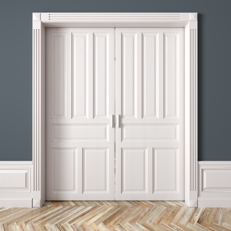 Interior of a room with classic white double sliding raised doors against blue wall 3d rendering